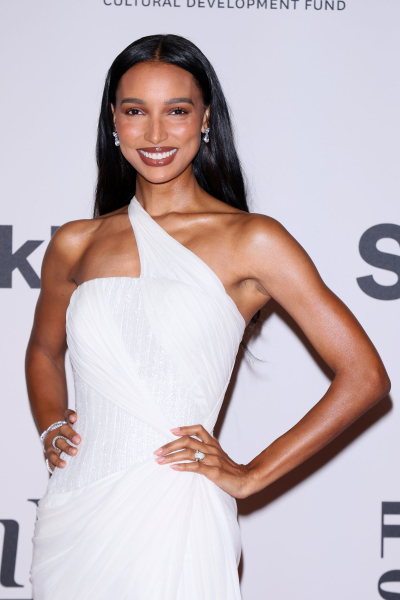 Jasmine Tookes wearing a white dress.
